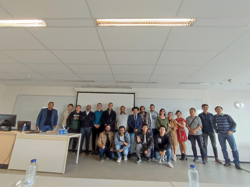 A group of people posing for a photoDescription automatically generated